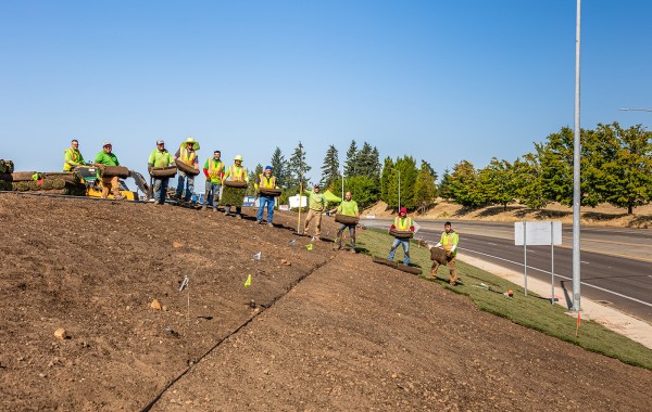 EarthTech Crew Installing Sod EarthTech Landscape Solutions Crew posing as they install sod for Costco in South Salem Photo by Lori Cegon