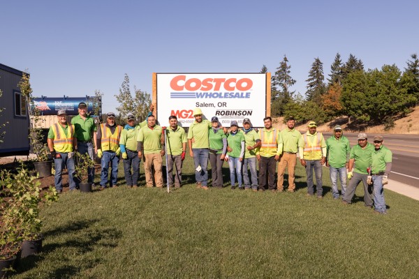 Planting - Crew Poses Planting crew posing by Costco Sign